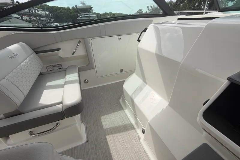 Slide: The Image of Interior of a 2021 Sea Ray Sundancer 320 boat, featuring sleek seating and modern design. - 25