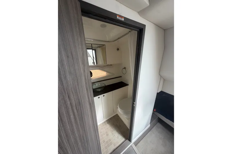 Slide: The Image of 2021 Sea Ray Sundancer 320 bathroom interior with modern fixtures and sleek design. - 35