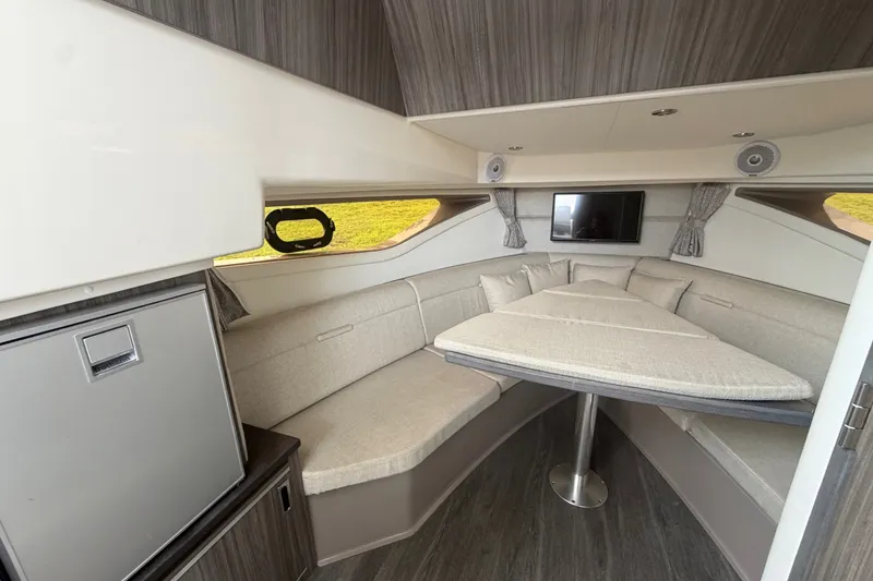 Slide: The Image of Interior of 2021 Sea Ray Sundancer 320, featuring a cozy seating area and modern amenities. - 40
