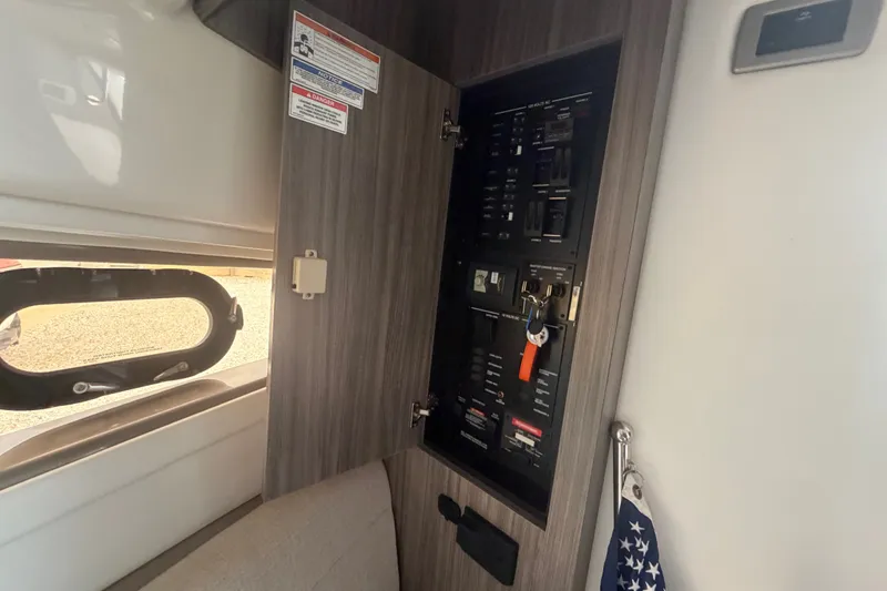 Slide: The Image of Electrical panel inside a 2021 Sea Ray Sundancer 320 yacht cabin. - 34