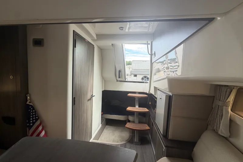 Slide: The Image of Interior of 2021 Sea Ray Sundancer 320 yacht, featuring modern design and compact layout. - 38
