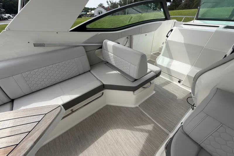 Slide: The Image of Luxurious interior of 2021 Sea Ray Sundancer 320 yacht with elegant seating and modern design. - 15
