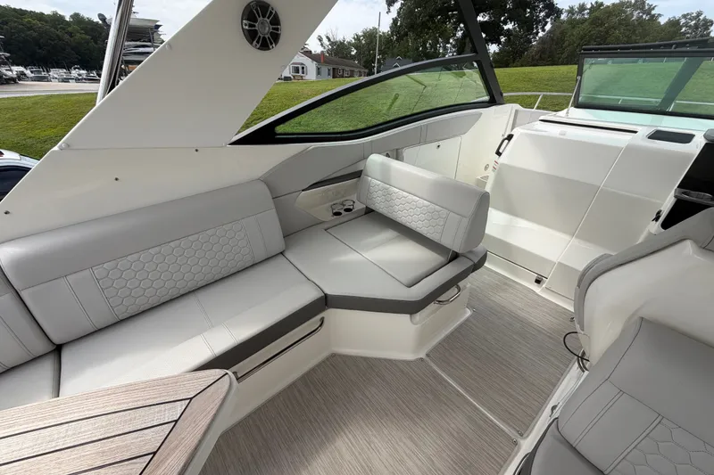 Slide: The Image of Interior of 2021 Sea Ray Sundancer 320, featuring sleek seating and modern design elements. - 17