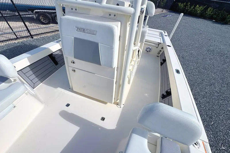Slide: The Image of 2023 Pathfinder 2200 TRS boat interior with seating and storage compartments. - 11