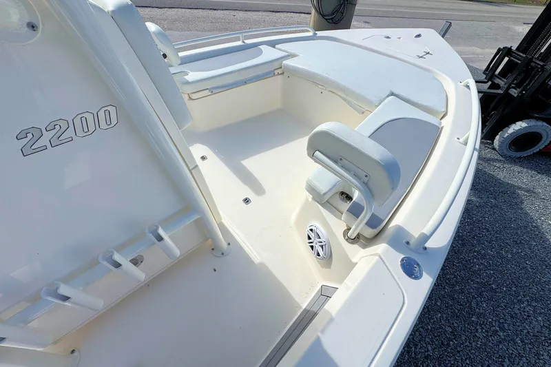 Slide: The Image of 2023 Pathfinder 2200 TRS boat interior with seating and storage compartments. - 9