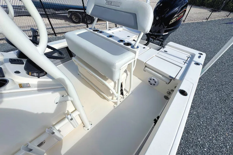 Slide: The Image of 2023 Pathfinder 2200 TRS boat interior with seating and motor, showcasing modern design. - 5