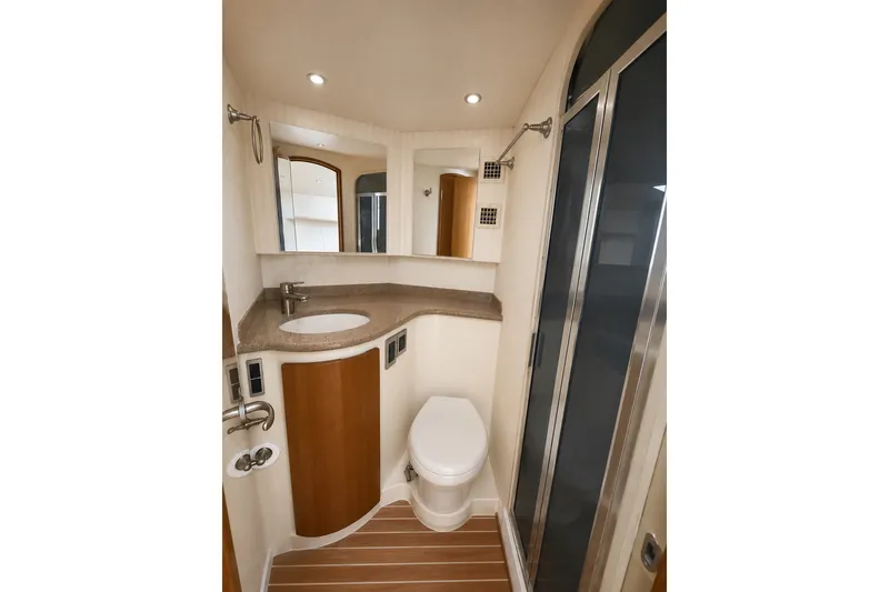 Slide: The Image of 2012 Viking 42 Open yacht bathroom with modern fixtures and wood accents. - 5