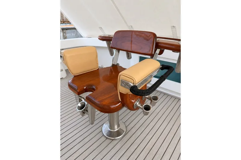 Slide: The Image of Luxurious seating on 2012 Viking 42 Open yacht with polished wood and leather accents. - 6