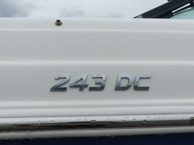 Slide: The Image of Close-up of the "243 DC" lettering on a white boat hull. - 9