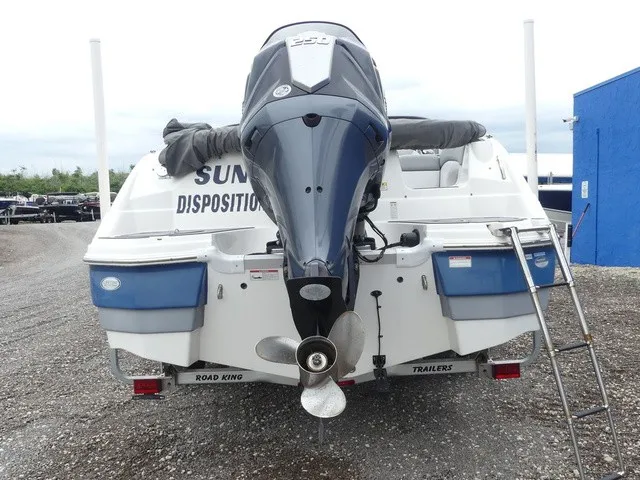 Slide: The Image of The image shows the rear of a 2023 NauticStar 243 DC boat with an outboard motor. - 6