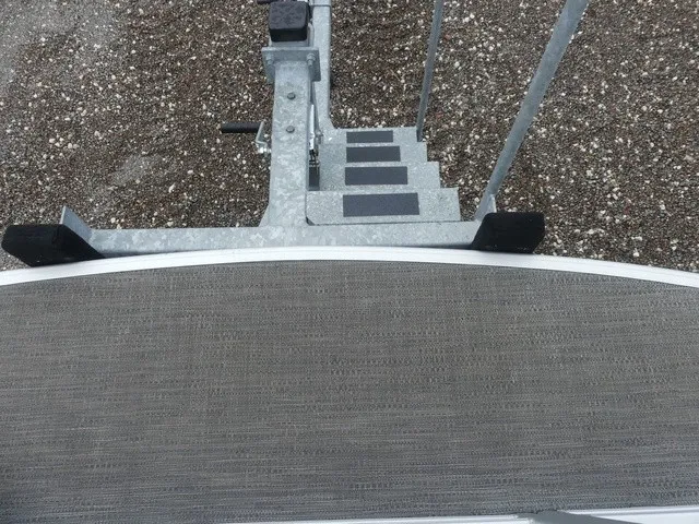 Slide: The Image of The 2024 Sweetwater SW 2286 SB features a sturdy carpeted platform and a metal staircase. - 30