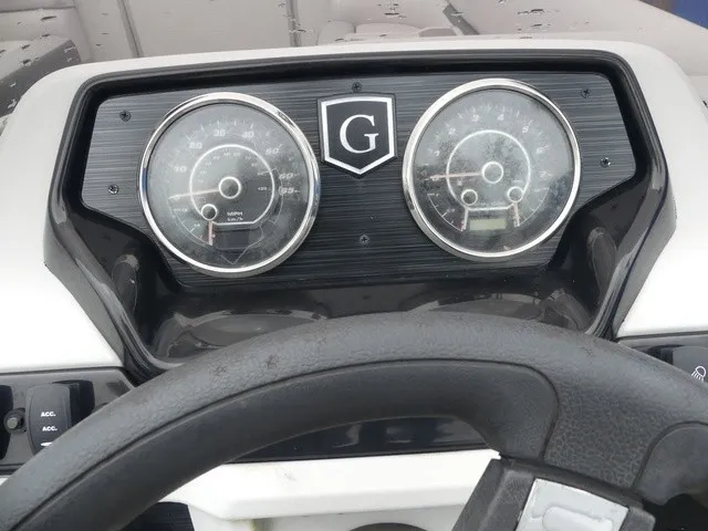 Slide: The Image of The image shows the dashboard of a Sweetwater SW 2286 SB boat with two large round gauges. - 20