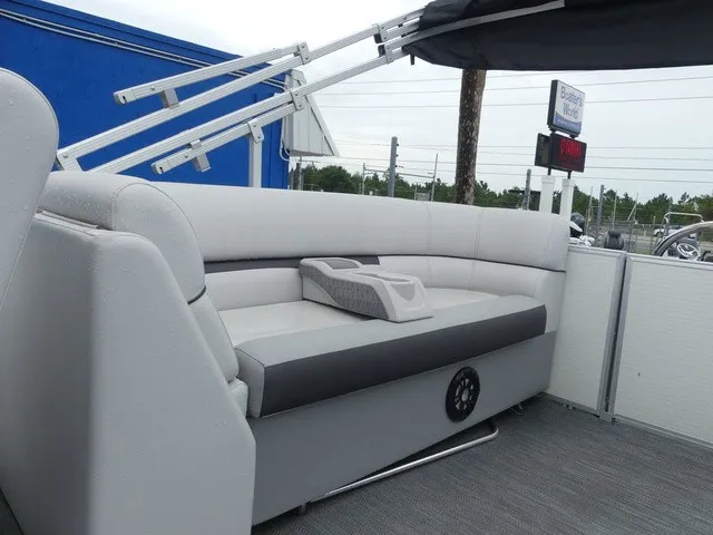 Slide: The Image of The image shows a 2024 Sweetwater SW 2286 SB with a gray bench seat and cup holder. - 26