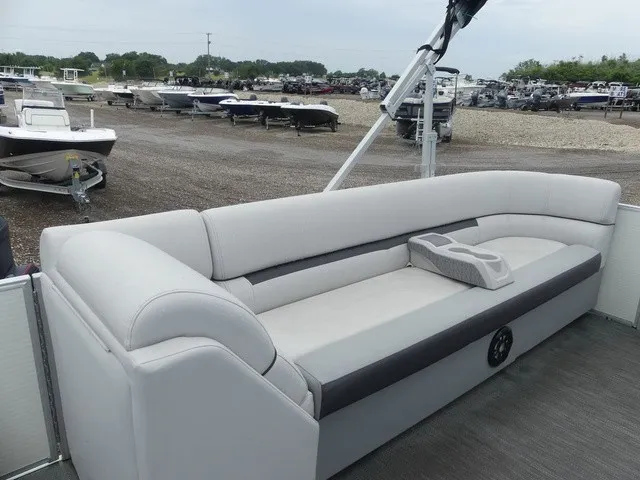 Slide: The Image of The image shows a 2024 Sweetwater SW 2286 SB with a gray outdoor seating area. - 16