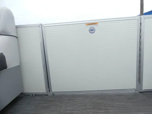 Slide: The Image of Interior view of a 2024 Sweetwater SW 2286 SB with gray carpeting and white walls. - 28