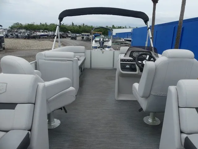 Slide: The Image of The image shows the interior of a 2024 Sweetwater SW 2286 SB pontoon boat with gray seating. - 15
