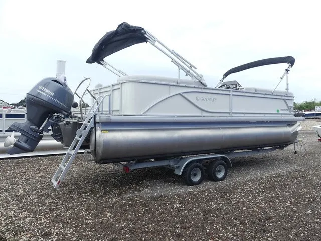 Slide: The Image of A 2024 Sweetwater SW 2286 SB pontoon boat on a trailer with a Yamaha outboard motor. - 5