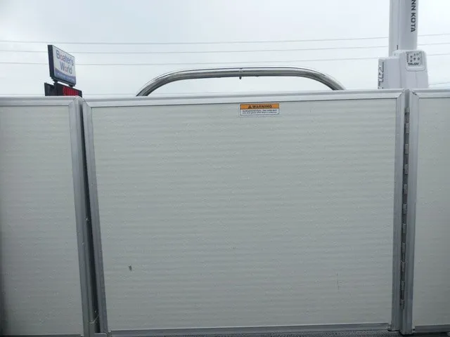 Slide: The Image of The image shows the stern of a Sweetwater SW 2286 SB pontoon boat with a safety warning. - 27