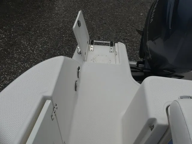 Slide: The Image of The image shows the stern of a Robalo R272 Center Console boat with an outboard motor. - 30