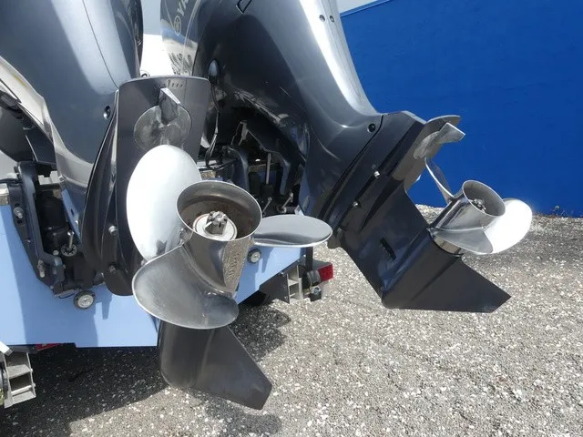 Slide: The Image of Close-up of two outboard engines with shiny propellers on a boat. - 11