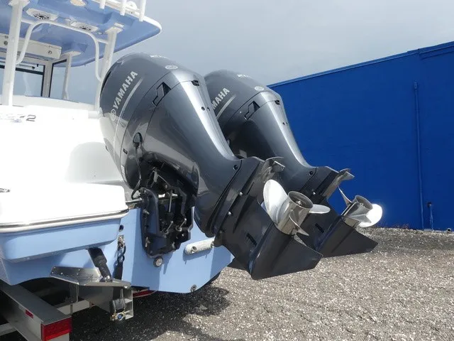 Slide: The Image of Two powerful outboard engines are mounted on the stern of a Robalo R272 Center Console boat. - 10