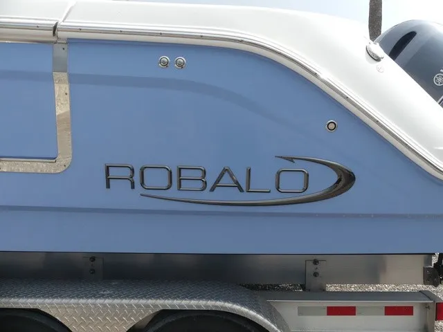 Slide: The Image of Close-up of a blue Robalo boat hull on a trailer. - 8