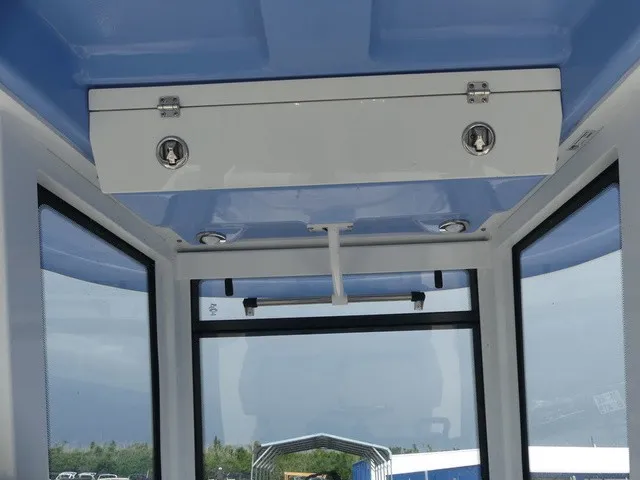 Slide: The Image of View of a boat's interior with a blue ceiling and white walls. - 19