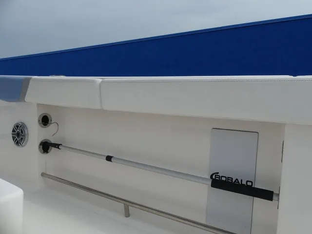 Slide: The Image of The image shows the interior of a 2022 Robalo R272 Center Console boat with rod holders. - 29