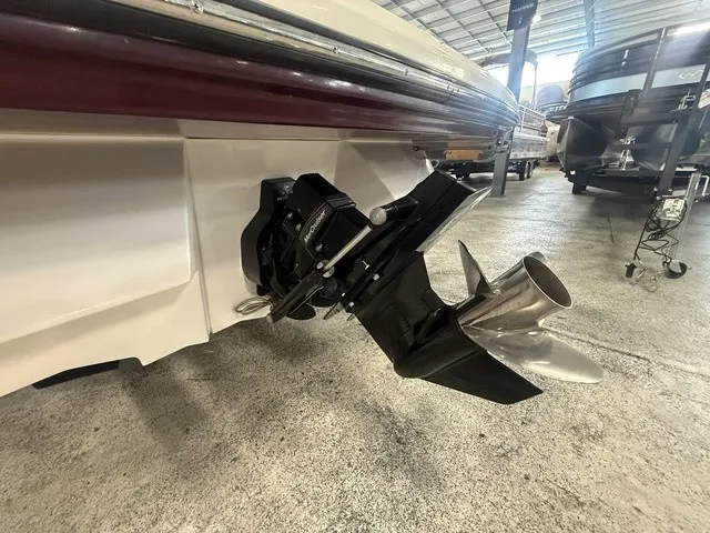 Slide: The Image of Close-up of the drive of a 2013 Sea Ray SLX 230 boat in a storage facility. - 11