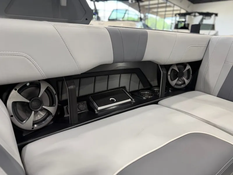Slide: The Image of The interior view shows a luxurious bench seat with built-in speakers and cup holders. - 17