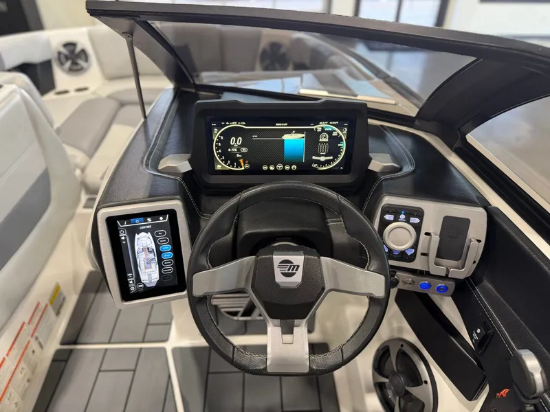 Slide: The Image of The image shows the cockpit of a 2021 Malibu Wakesetter 24 MXZ with modern instruments. - 15