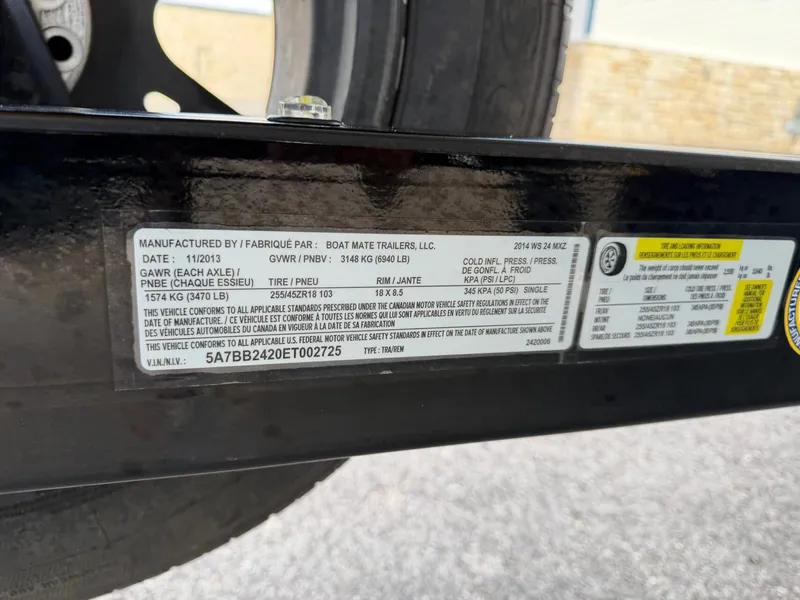 Slide: The Image of Close-up of a boat trailer with manufacturer label and technical details. - 28