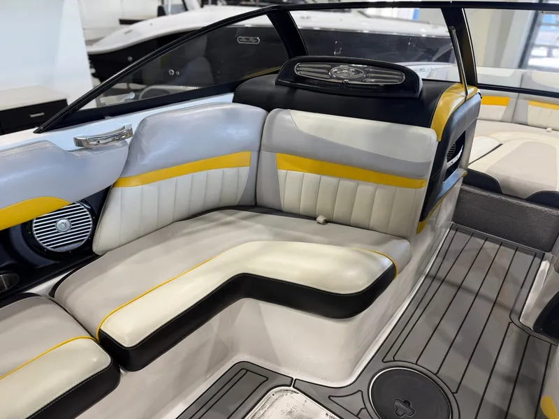 Slide: The Image of The image shows the interior of a 2014 Malibu Wakesetter 24 MXZ with stylish seating. - 14
