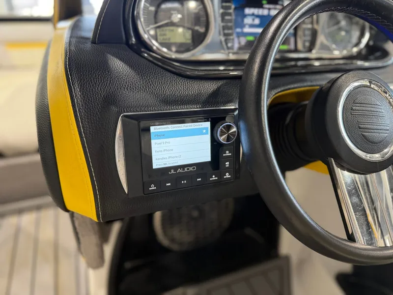 Slide: The Image of Close-up of a Malibu Wakesetter 24 MXZ dashboard featuring a JL Audio system. - 17