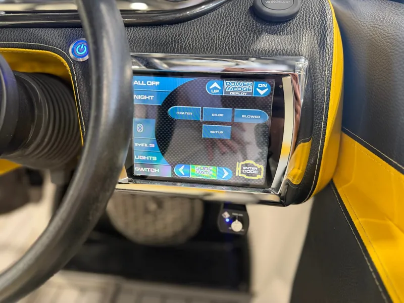 Slide: The Image of Close-up of a boat control panel with touchscreen and yellow accents. - 18