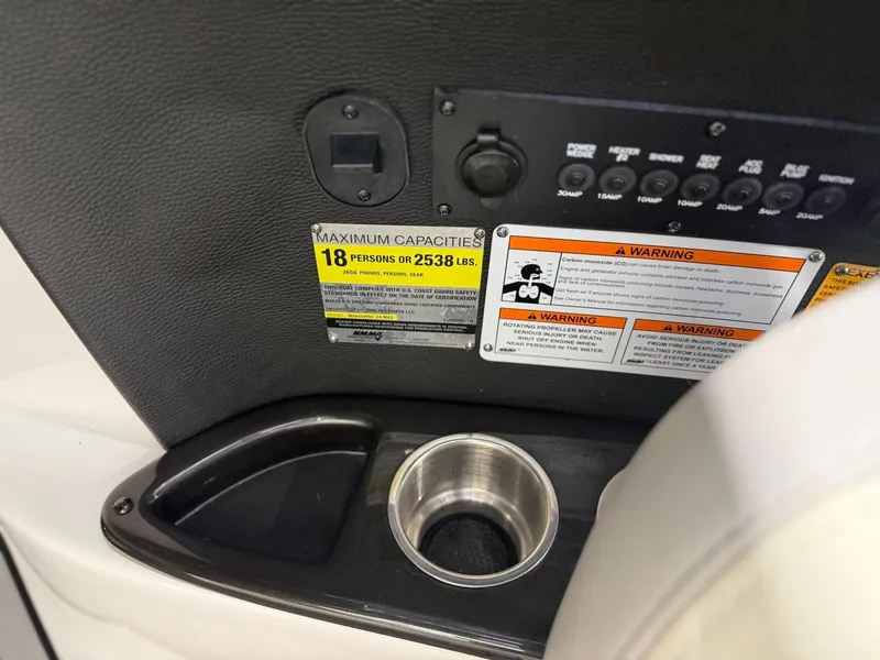 Slide: The Image of Close-up of a boat console area with a cup holder and capacity labels. - 20