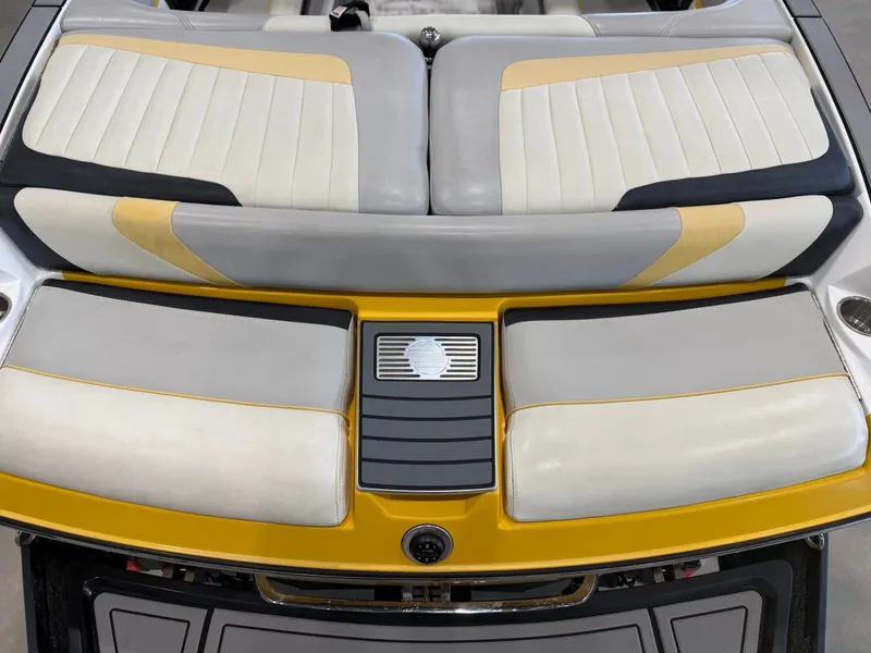 Slide: The Image of The image shows the rear of a 2014 Malibu Wakesetter 24 MXZ with cushioned seating. - 10
