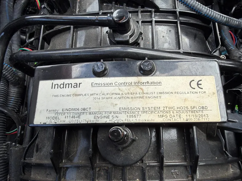 Slide: The Image of Close-up of an Indmar engine with emission control information and technical details. - 30