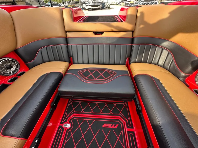 Slide: The Image of The image shows the luxurious interior of a 2023 MB SPORTS B52 boat with stylish seating. - 14