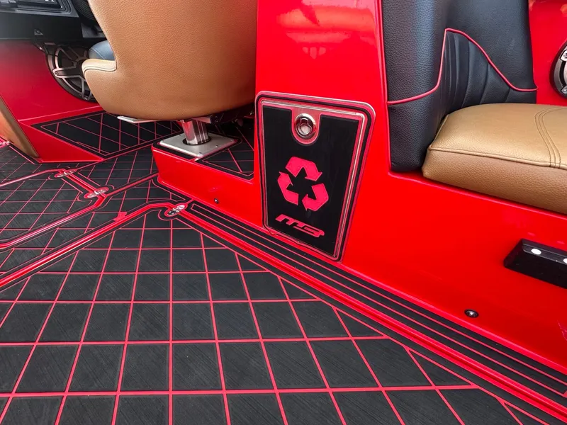 Slide: The Image of The image shows the interior of a 2023 MB SPORTS B52 with red and black accents. - 40