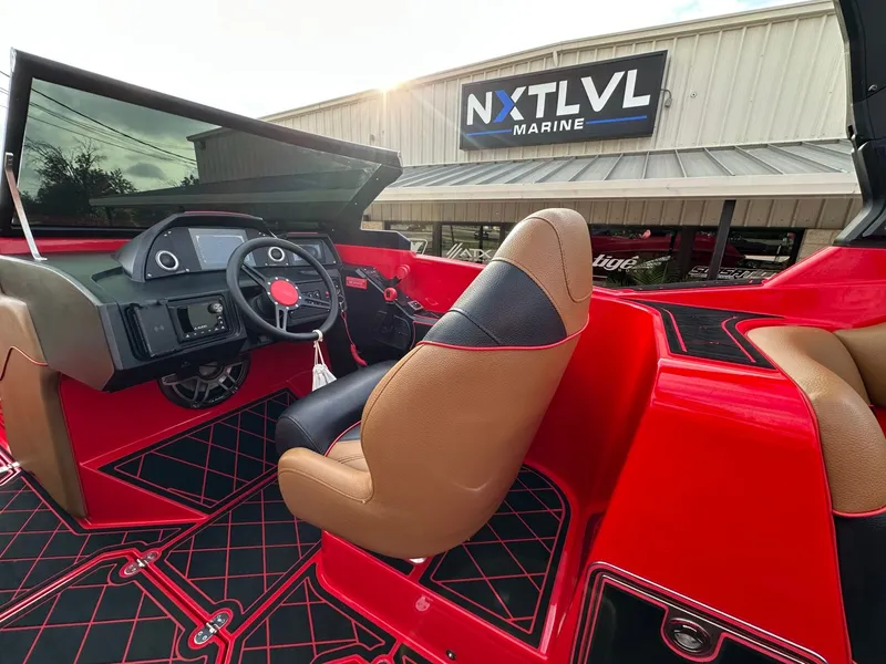 Slide: The Image of Interior view of a 2023 MB SPORTS B52 with red and black interior. - 18