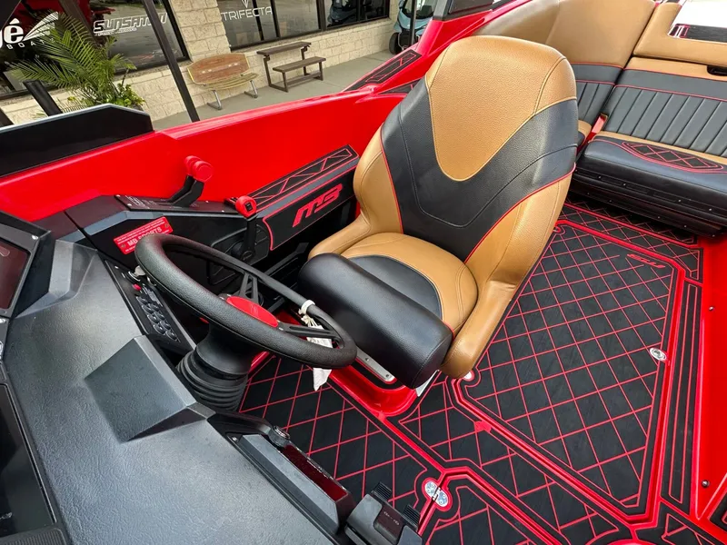 Slide: The Image of The image shows the cockpit of a 2023 MB SPORTS B52 with a brown and black seat. - 29