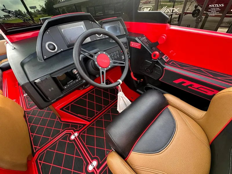 Slide: The Image of The cockpit of a 2023 MB SPORTS B52 with red and black interior and modern instruments. - 21