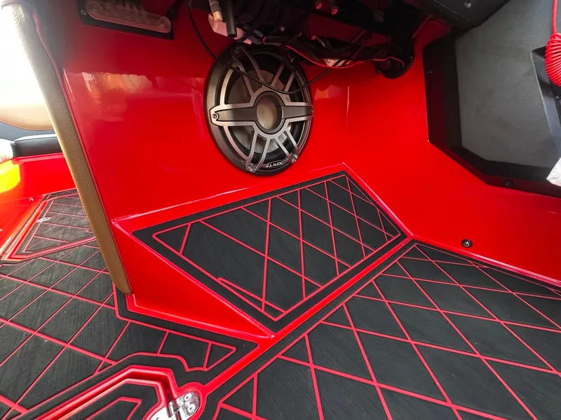 Slide: The Image of The image shows the interior of a 2023 MB SPORTS B52 with red and black accents. - 38
