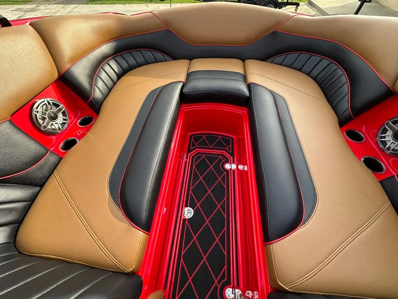 Slide: The Image of The image shows the luxurious interior of a 2023 MB SPORTS B52 boat with stylish seating. - 23