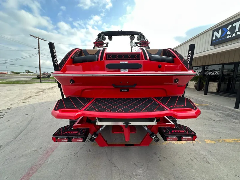 Slide: The Image of A red 2023 MB SPORTS B52 boat with stylish design and black accents on the deck. - 4