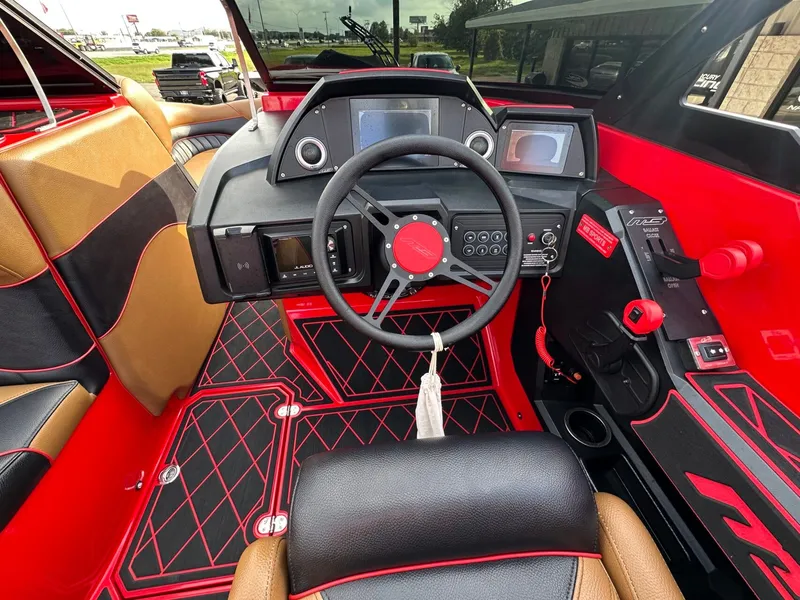 Slide: The Image of The image shows the cockpit of a 2023 MB SPORTS B52 with modern instruments and red accents. - 20