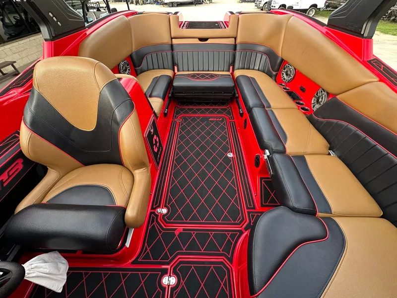 Slide: The Image of The image shows the luxurious interior of a 2023 MB SPORTS B52 boat with red and black accents. - 30
