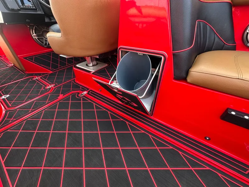 Slide: The Image of The image shows the interior of a 2023 MB SPORTS B52 with red and black accents. - 39