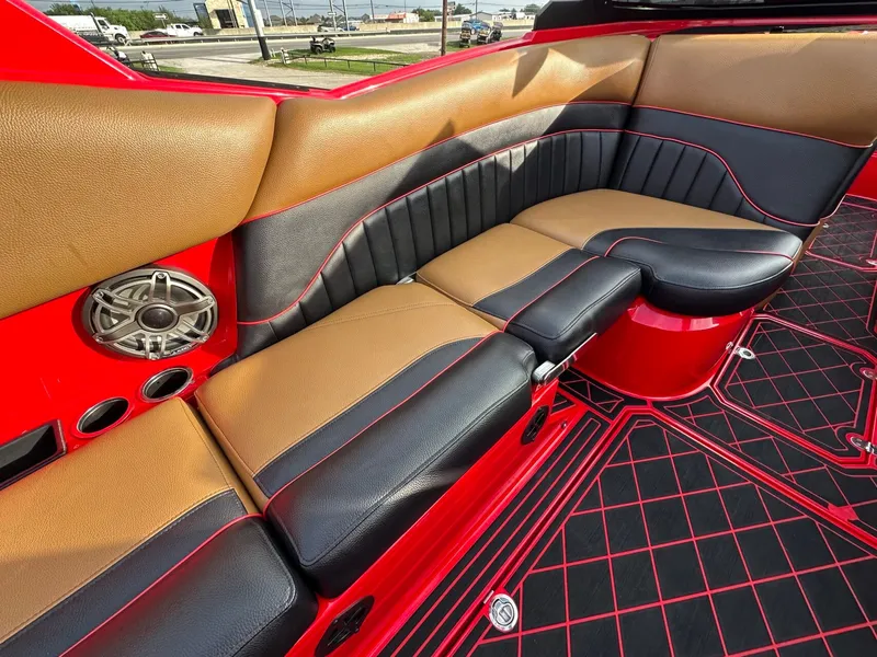 Slide: The Image of The image shows the interior of a 2023 MB SPORTS B52 with red and black seating. - 16